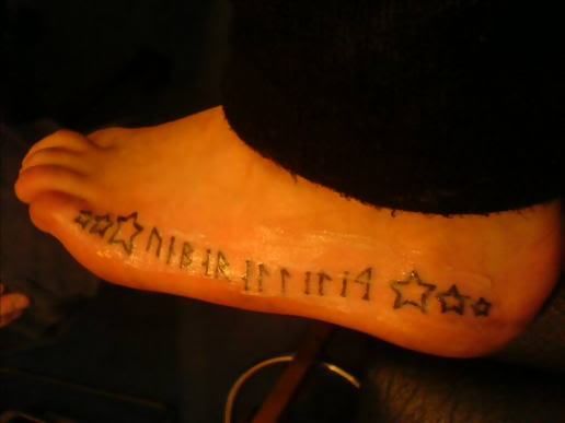 tattoos of writing on foot